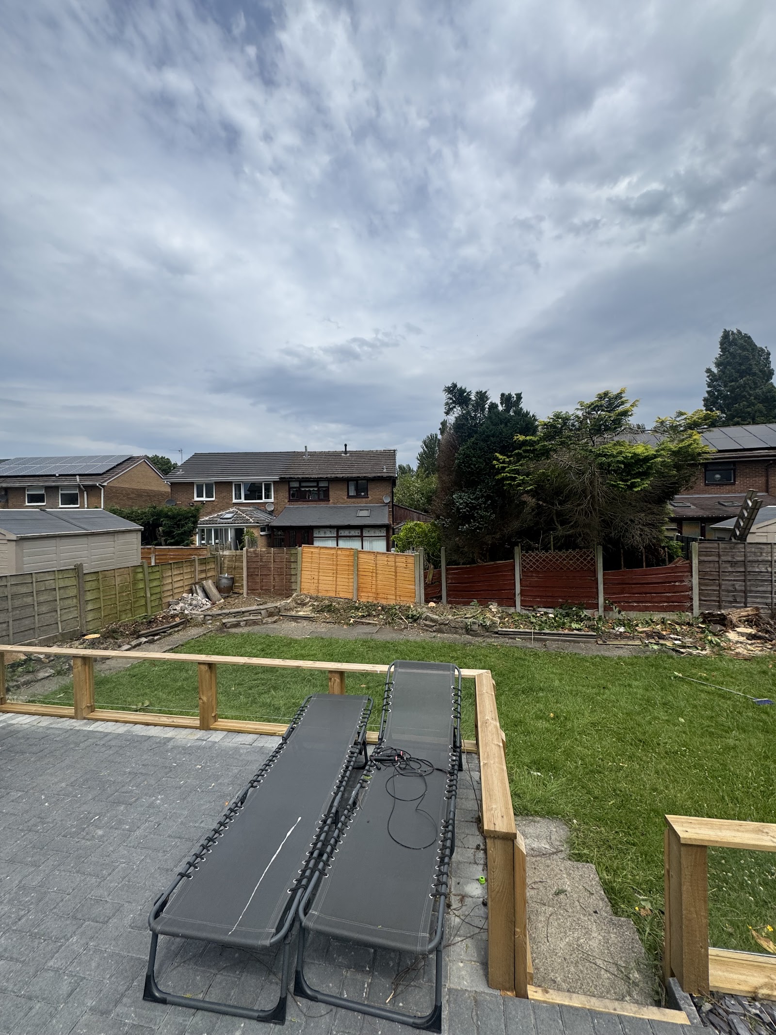 Freshly laid patio and a cleared garden after Dylan's Tree Services worked on the plot